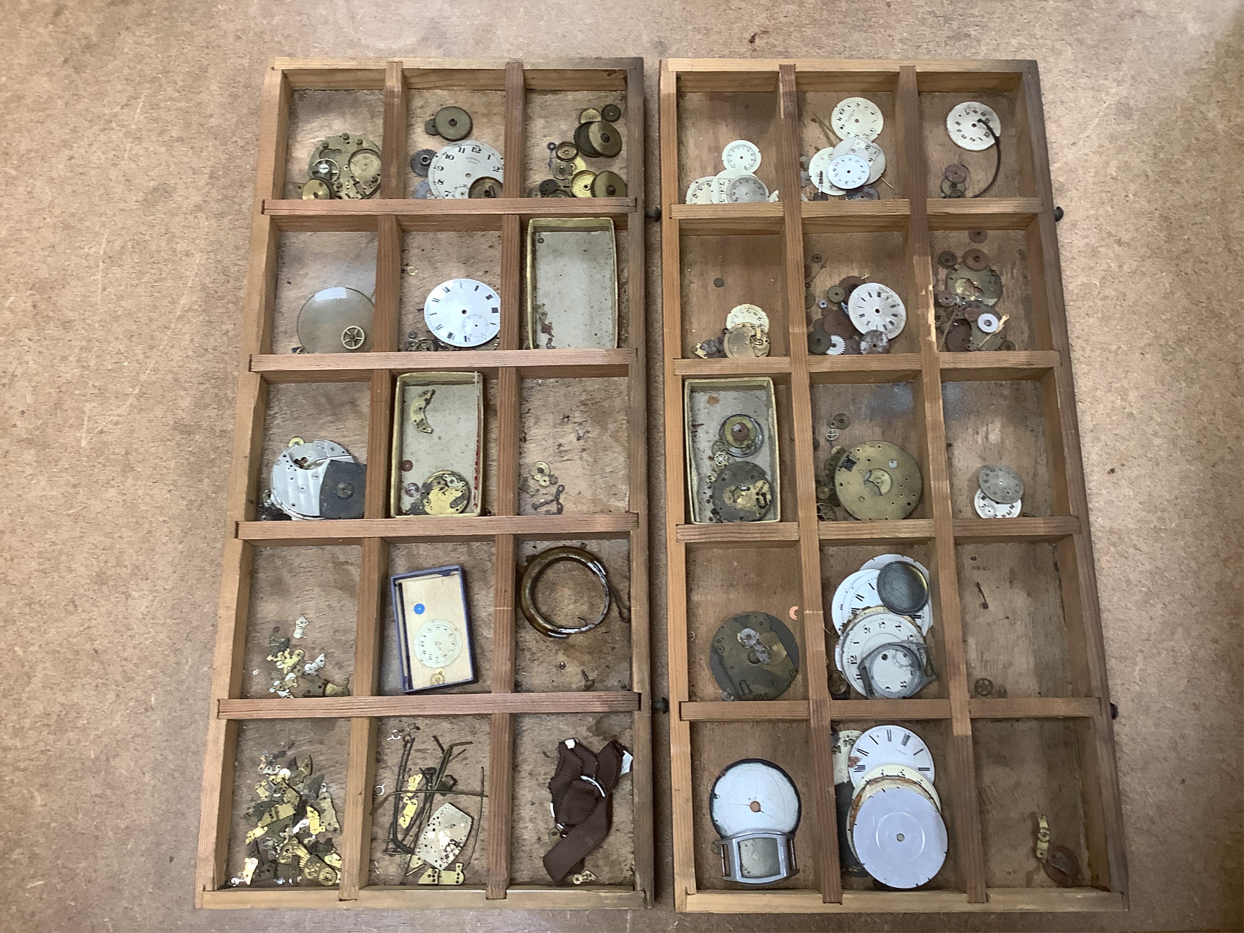 A wooden twelve drawer cabinet containing a collection of watch parts. Condition - cabinet fair to good, watch parts as found